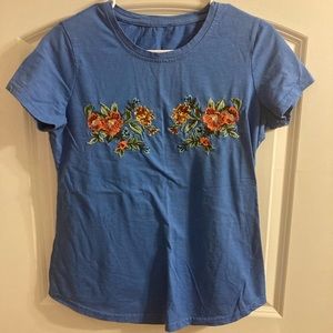 Light blue with flowers! One of my favorite t shirts. Just have too many clothes